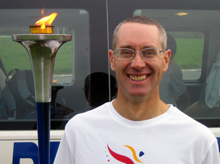 Amalendu Edelsten holding the World Harmony Run torch