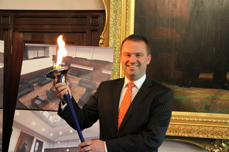 Premier of Tasmania David Bartlett holds the World Harmony Run Torch 2010