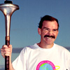 Rob De Castella holds Peace Torch, 1991