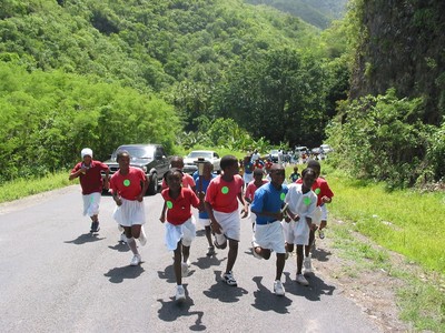 Kids of Dominica climb a tall hill