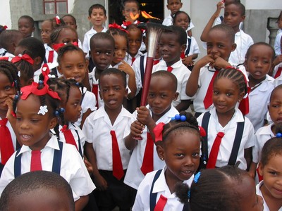 Primary school children pose with torch, Grenada