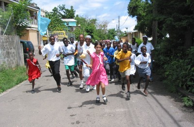 Girl with pink dress runs in Grenada