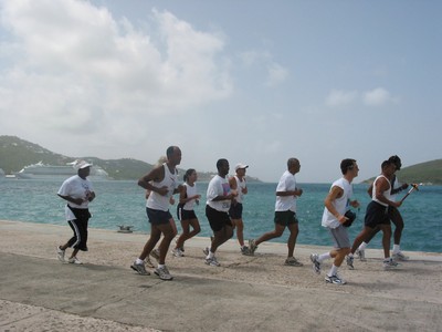 Senator Louis P. Hill, St. Thomas, leads group by the water