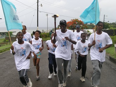 St. Kitts runners with flags
