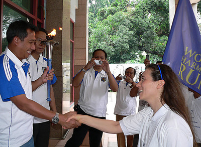 Mr. Hasanuddin Yusuf, President of KNPI, receives the torch