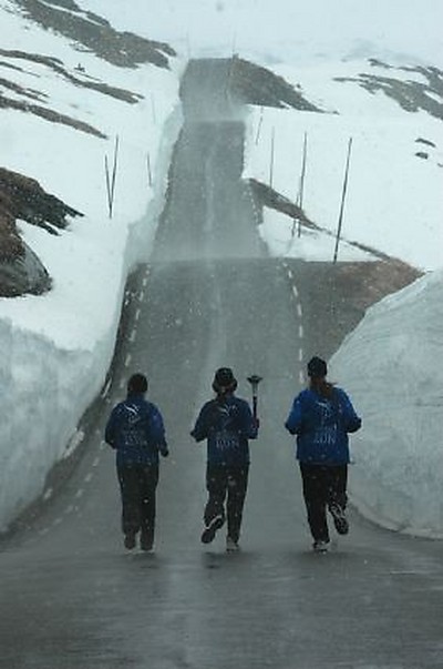 Runners in snowstorm-vertic