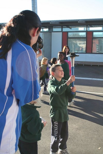Bhuvah is busy taking photos of the torch bearers.