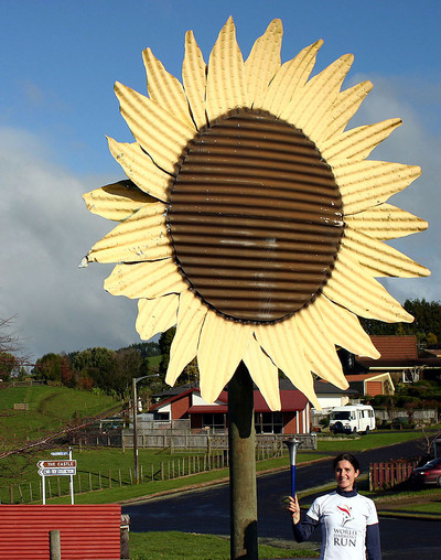 Amy (our photographer this week) with the big sunflower