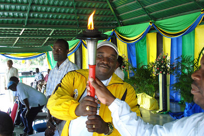 Government official with the Harmony Run Torch.