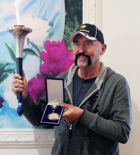 Don Tolman receives World Harmony Run Torch-Bearer Award