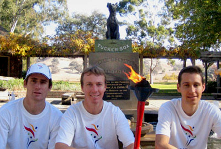 Nigel Webber holding the World Harmony Run Torch