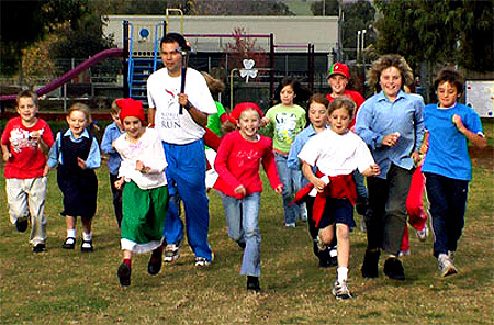 Noivedya Juddery runs with children in World Harmony Run