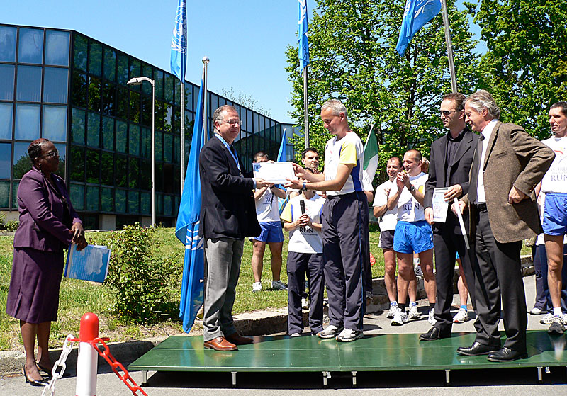 Certificates of appreciation are given to the three directors...