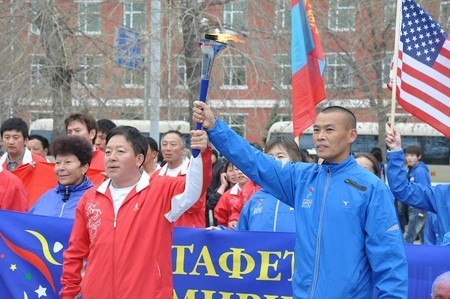 national and International team share torch